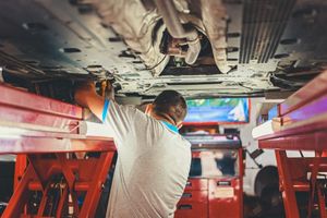 technician aligning front wheels